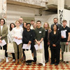 The winning team of the Smash the Box Challenge can be seen in a hall with high ceilings