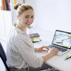 Student sitting at her desk in front of her laptop. 