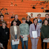 A group of students with certificates in hand