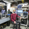 Several people with mask stand in a laboratory