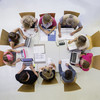 People sitting in a circle talking shot from above.